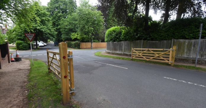 Residents of the Birmingham millionaires estate warned of legal action as the plan to close the gates was canceled

